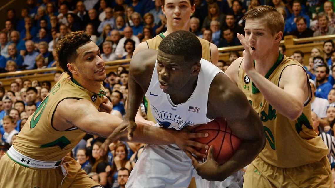 Duke forward Sean Obi is fouled as he wrestles a rebound from the Notre Dame defense on Jan. 16. The school announced Tuesday that Obi is transferring.