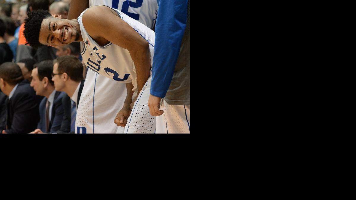 
Senior Duke guard Quinn Cook (2) smiles at the crowd from the bench as he plays his final game at Cameron Indoor Stadium. Duke beat Wake Forest University 94-51 Wednesday, March 4, 2015 at Cameron Indoor Stadium in Durham, NC.
