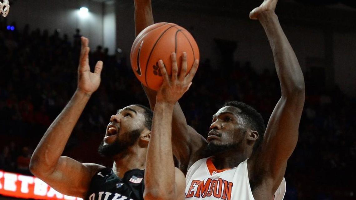 Duke guard Matt Jones (13) gets past Clemson center Landry Nnoko (35) to score in the second half of play of Wednesday’s loss to Clemson. Duke was upset by Clemson 68-63 in Greenville, S.C.