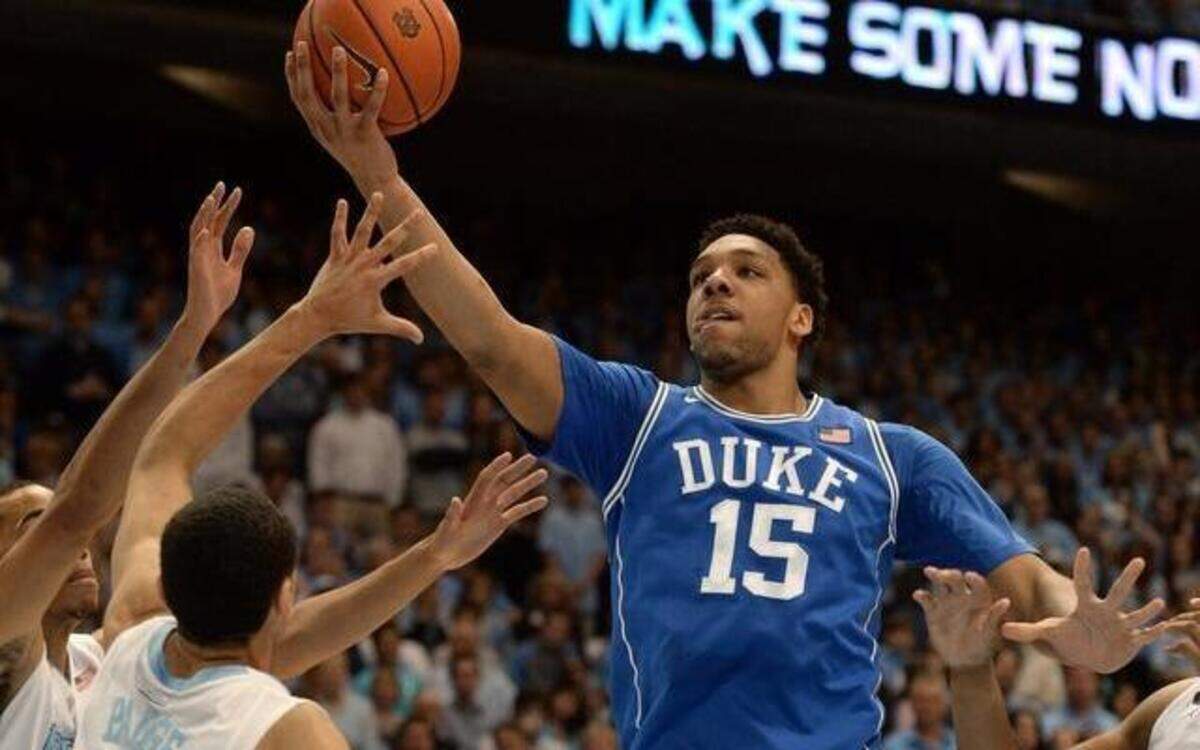 
Duke center Jahlil Okafor (15) goes in for two points in the first half as UNC guard Marcus Paige (5) defends. Duke and UNC battled at the Dean Smith Center in Chapel Hill, Saturday, March 7, 2015 in the final game of the regular season.
