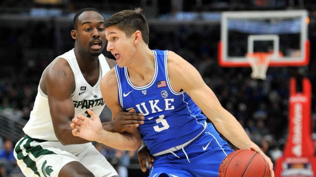 Duke guard Grayson Allen (3) drives on Michigan State guard Joshua Langford during the first half of an NCAA college basketball game Tuesday, Nov. 14, 2017, in Chicago.