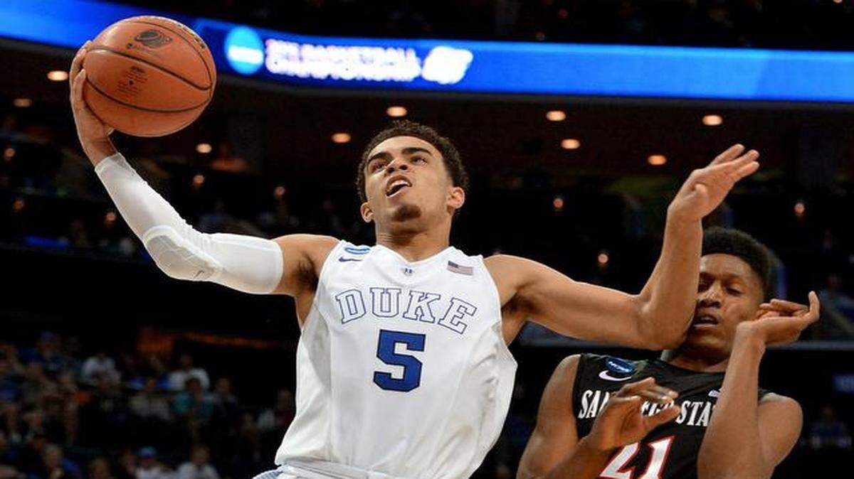 
Duke guard Tyus Jones (5) scores over San Diego State forward Malik Pope (21) as Duke beat San Diego State University 68-49 at the Time-Warner Cable Arena in Charlotte on Sunday, March 22, 2015. Jones has declared for the NBA Draft.
