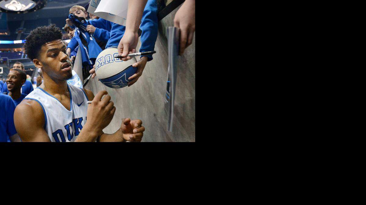 
Duke senior point guard Quinn Cook signs autographs after practice at the Time Warner Cable Arena in Charlotte, N.C. Thursday, March 19, 2015. The number one seeded Blue Devils will play Robert Morris Friday in their opening round game.
