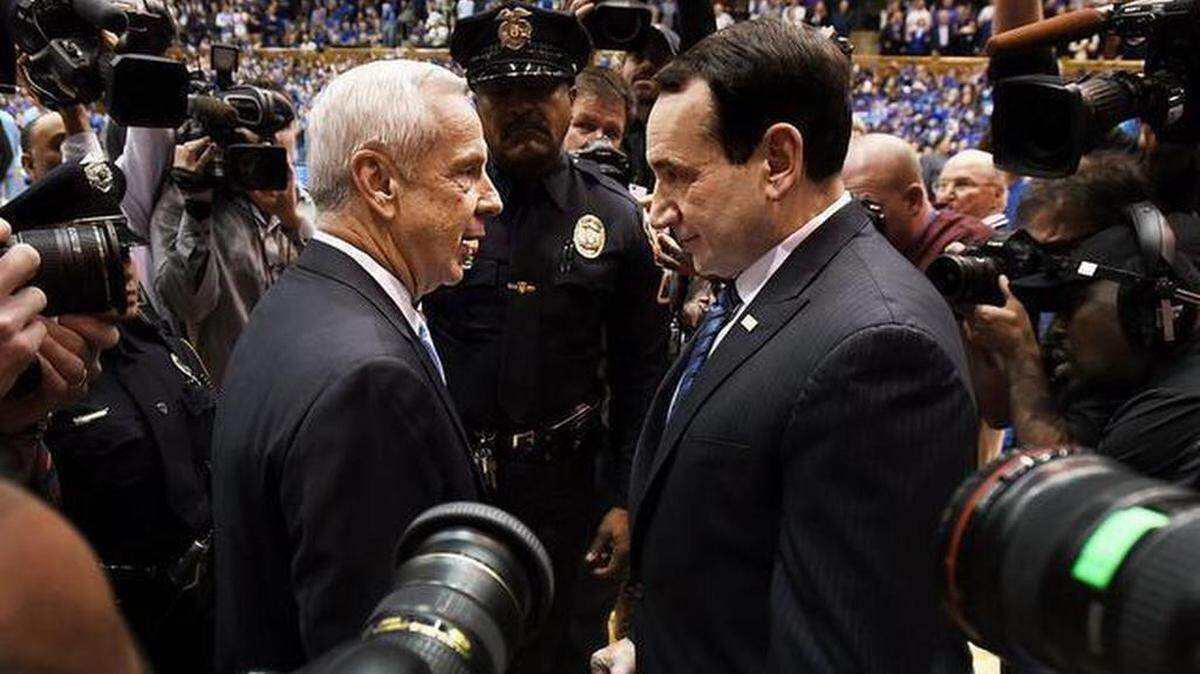 Duke head coach Mike Krzyzewski (right) and North Carolina head coach Roy Williams greet each other prior to their game at Cameron Indoor Stadium. Duke beat North Carolina 92-90 in overtime in Durham, NC Wednesday, Feb. 18, 2015.