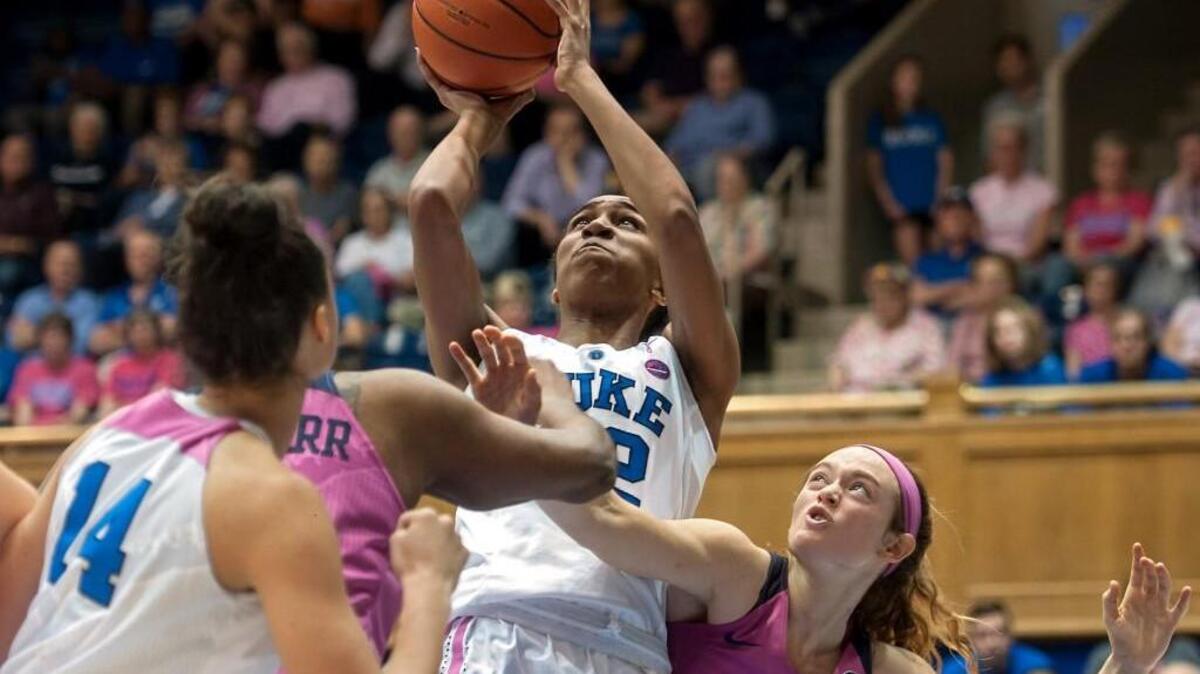 Duke's Oderah Chidom shoots over Pitt's Breanna Wise at Cameron Indoor Stadium. Chidom has been drafted by the WNBA’s Atlanta Dream.
