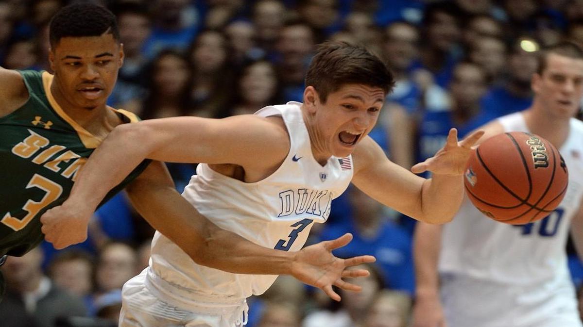Duke guard Grayson Allen steals the ball from Siena guard Ryan Oliver during first-half action at Cameron Indoor Stadium.