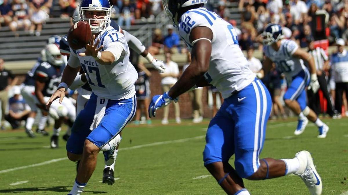 Duke's Daniel Jones (17) makes a shuffle pass to Brittain Brown (22) in the first half against Virginia Saturday, Oct. 7, 2017, in Charlottesville, Va. (Zack Wajsgras//The Daily Progress via AP)