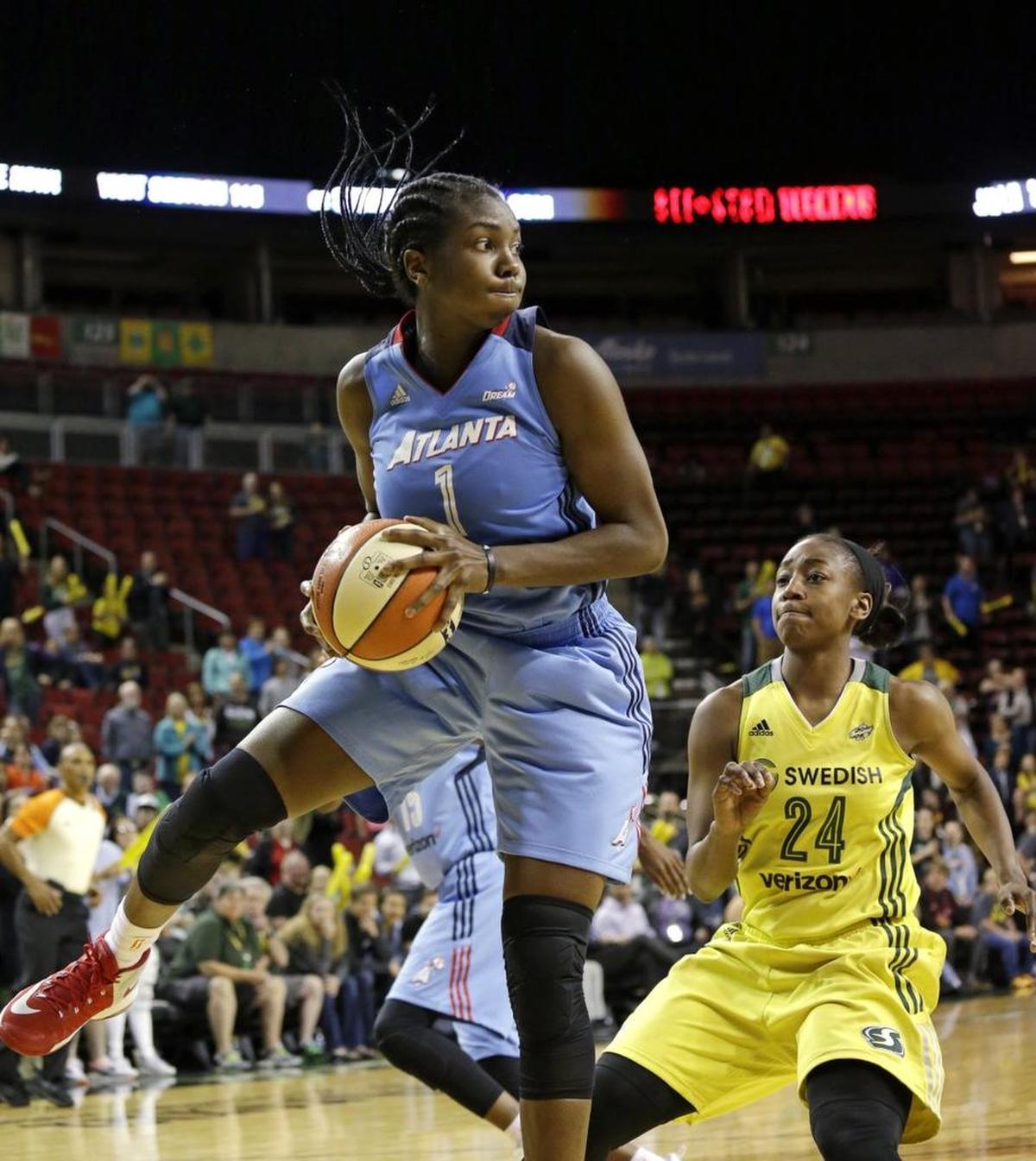 Atlanta Dream's Elizabeth Williams in action against the Seattle Storm in a WNBA basketball game Tuesday, June 13, 2017 in Seattle. The Dream won 91-86 in overtime. (AP Photo/Elaine Thompson)