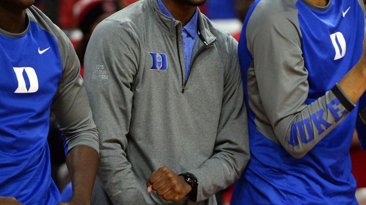 Duke forward Amile Jefferson is all smiles on the bench as the Blue Devils pull ahead and defeat the Wolfpack 88-78 at the PNC Arena on January 23. Jefferson was not wearing the boot on his injured foot at the game.