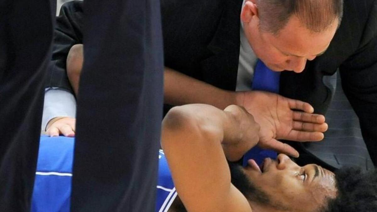 Duke assistant athletic trainer Jose Fonseca checks on forward Marvin Bagley III during the first half against Michigan State.