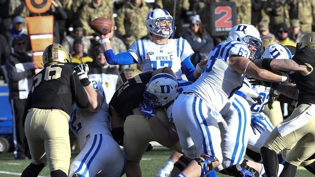 Duke quarterback Daniel Jones, middle, looks to pass against Army on Nov. 11. Marcus Johnson, the Blue Devils’ offensive line coach, is leaving Duke for Mississippi State.