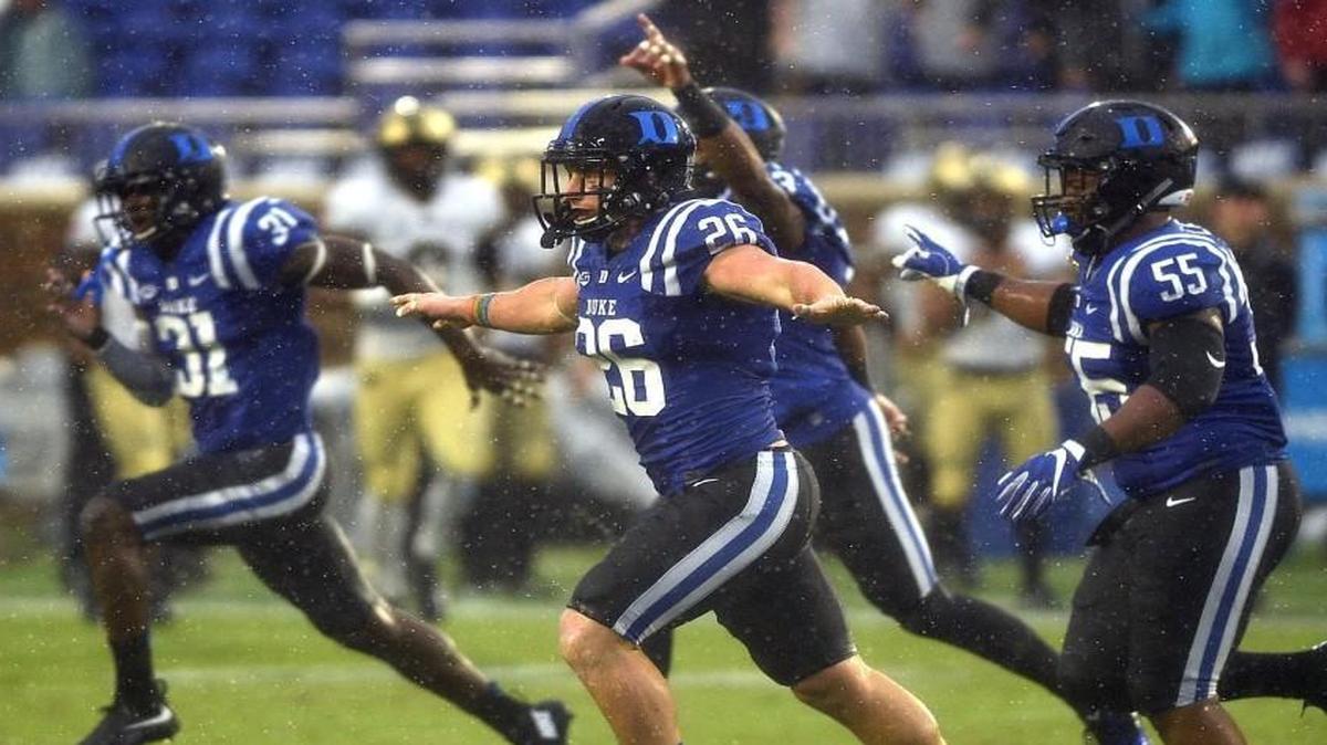 Duke’s Corbin McCarthy (26) and Brandon Boyce (55) celebrate following a defensive play against Army at Wallace Wade Stadium.