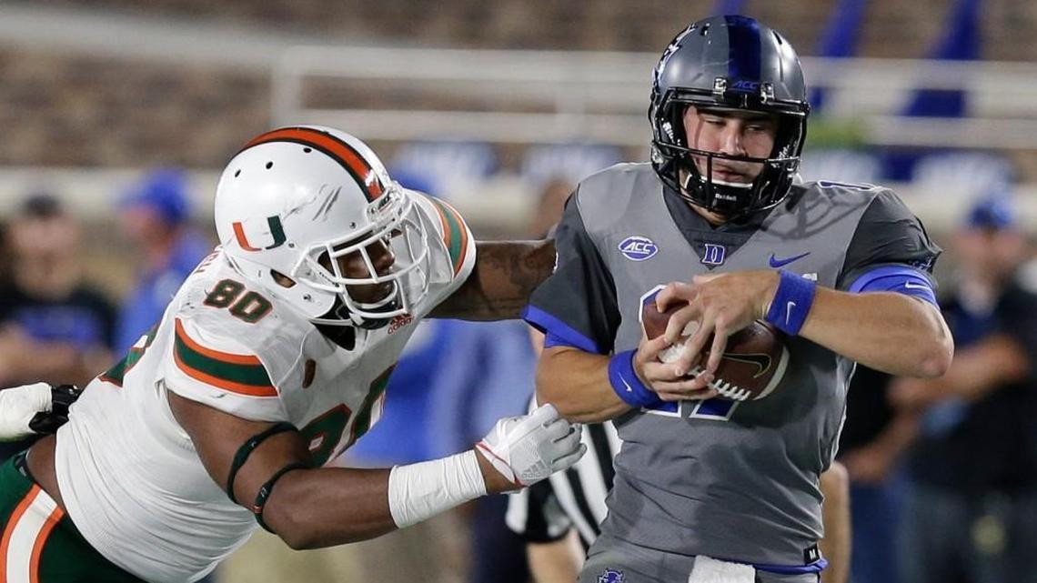 Miami's RJ McIntosh (80) chases Duke quarterback Daniel Jones during the first half in Durham on Sept. 29, 2017. (AP Photo/Gerry Broome)