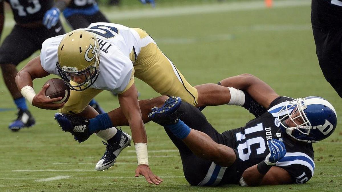Duke safety Jeremy Cash trips up Georgia Tech quarterback Justin Thomas on Sept. 26. Cash is expected to be taken anywhere from the second to seventh round of the NFL Draft, which starts Thursday.