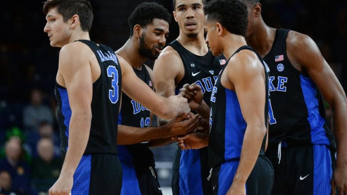 Duke guard Matt Jones, middle, encourages his team against Notre Dame on Jan. 30.