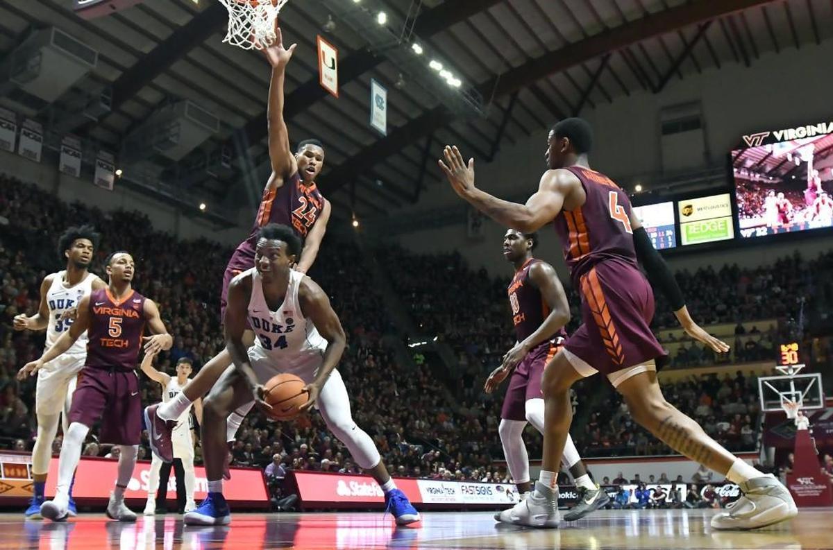 Virginia Tech forward Kerry Blackshear Jr. (24) shuts down Duke forward Wendell Carter Jr (34) during the second half of play. Duke was upset by Virginia Tech 64-63 at Cassell Coliseum, Monday, Feb. 26, 2018 in Blacksburg, Va.