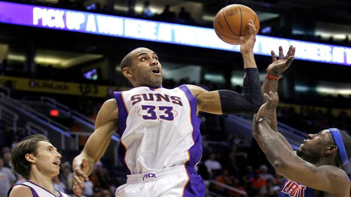
Phoenix Suns' Grant Hill (33) tries to grab a rebound in front of Detroit Pistons' Ben Wallace (6) as Suns' Steve Nash looks on in the fourth quarter of an NBA basketball game Friday, March 16, 2012, in Phoenix. The Suns went onto win the game.
