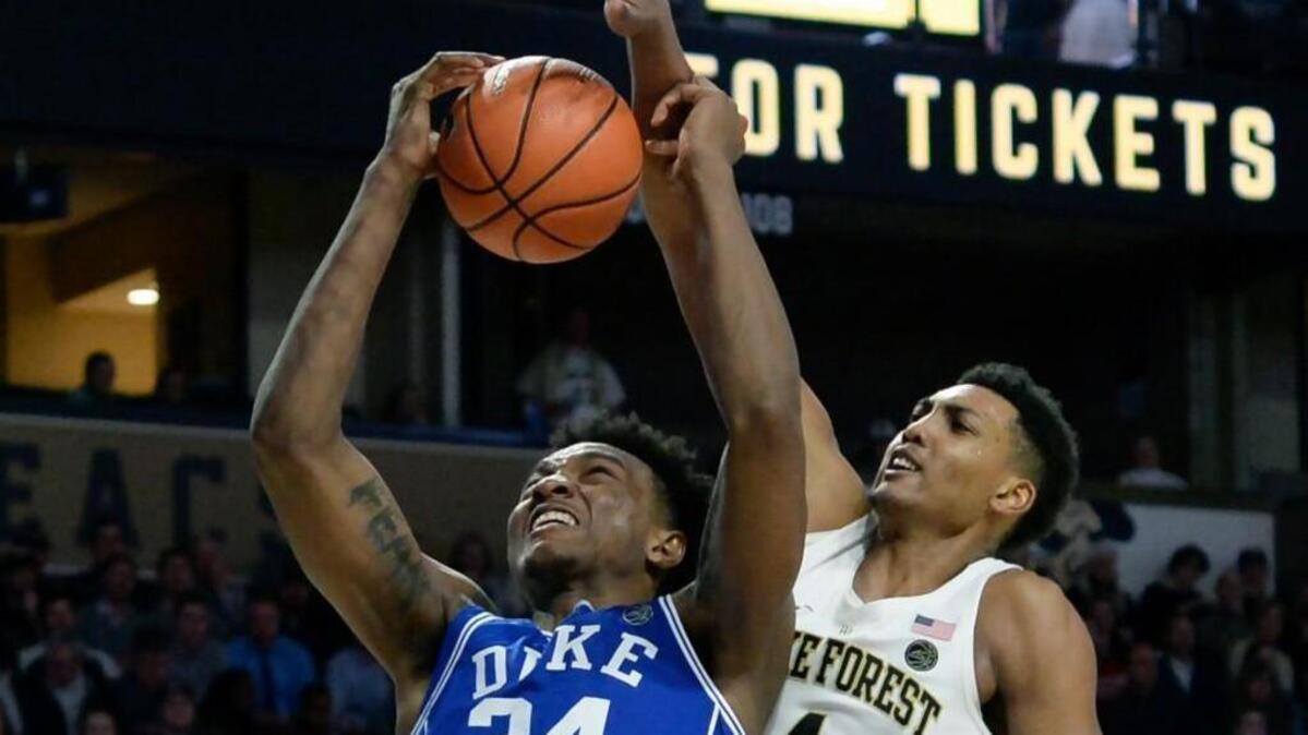 Duke forward Wendell Carter Jr., left, is fouled by Wake Forest center Doral Moore in the Blue Devils’ 84-70 win over the Demon Deacons on Tuesday.
