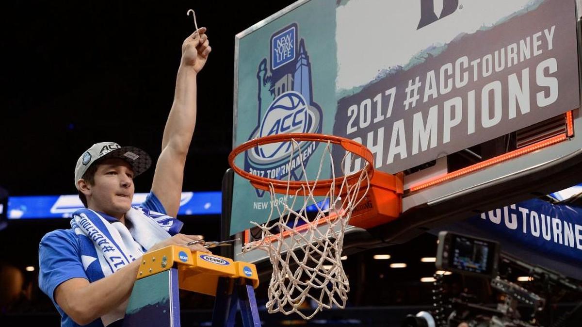 Duke guard Grayson Allen (3) helps cut down the nets after the Blue Devils beat Notre Dame to 75-69 to win the ACC tournament at the Barclays Center in Brooklyn, N.Y. on March 11, 2017.