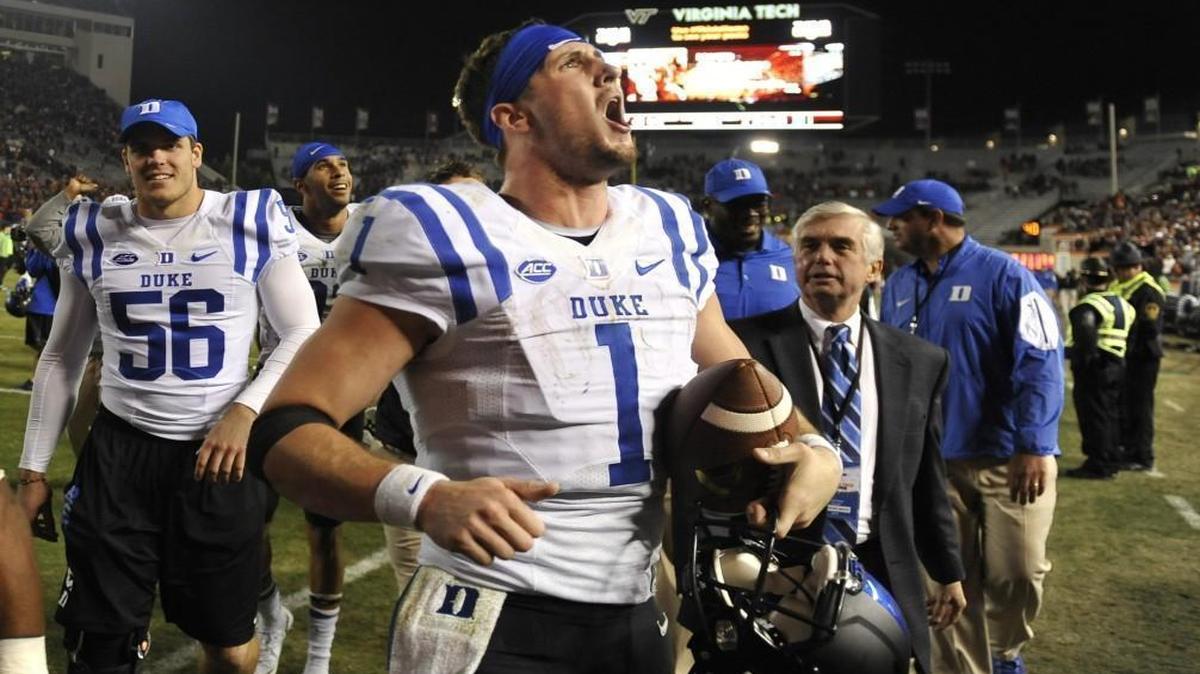 Duke quarterback Thomas Sirk (1) celebrates following the Blue Devils 45-43 quadruple overtime victory against the Virginia Tech Hokies at Lane Stadium in Blacksburg.
