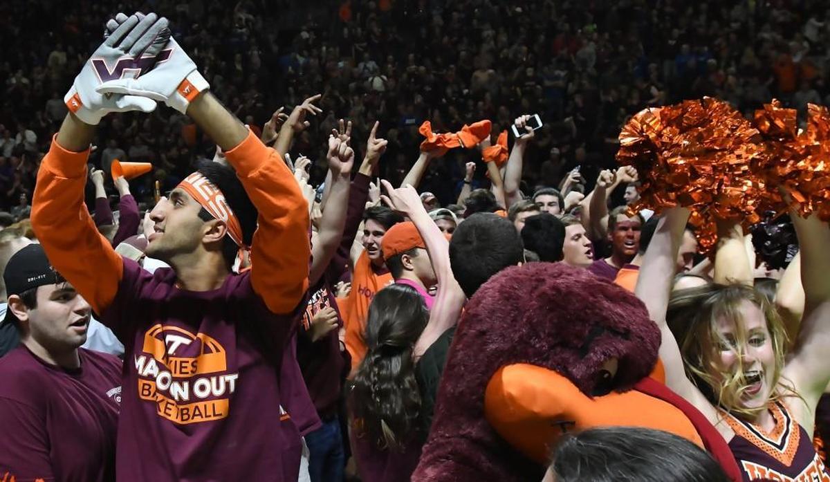 Hokie fans rush the court as Duke was upset by Virginia Tech 64-63 at Cassell Coliseum, Monday, Feb. 26, 2018 in Blacksburg, Va.