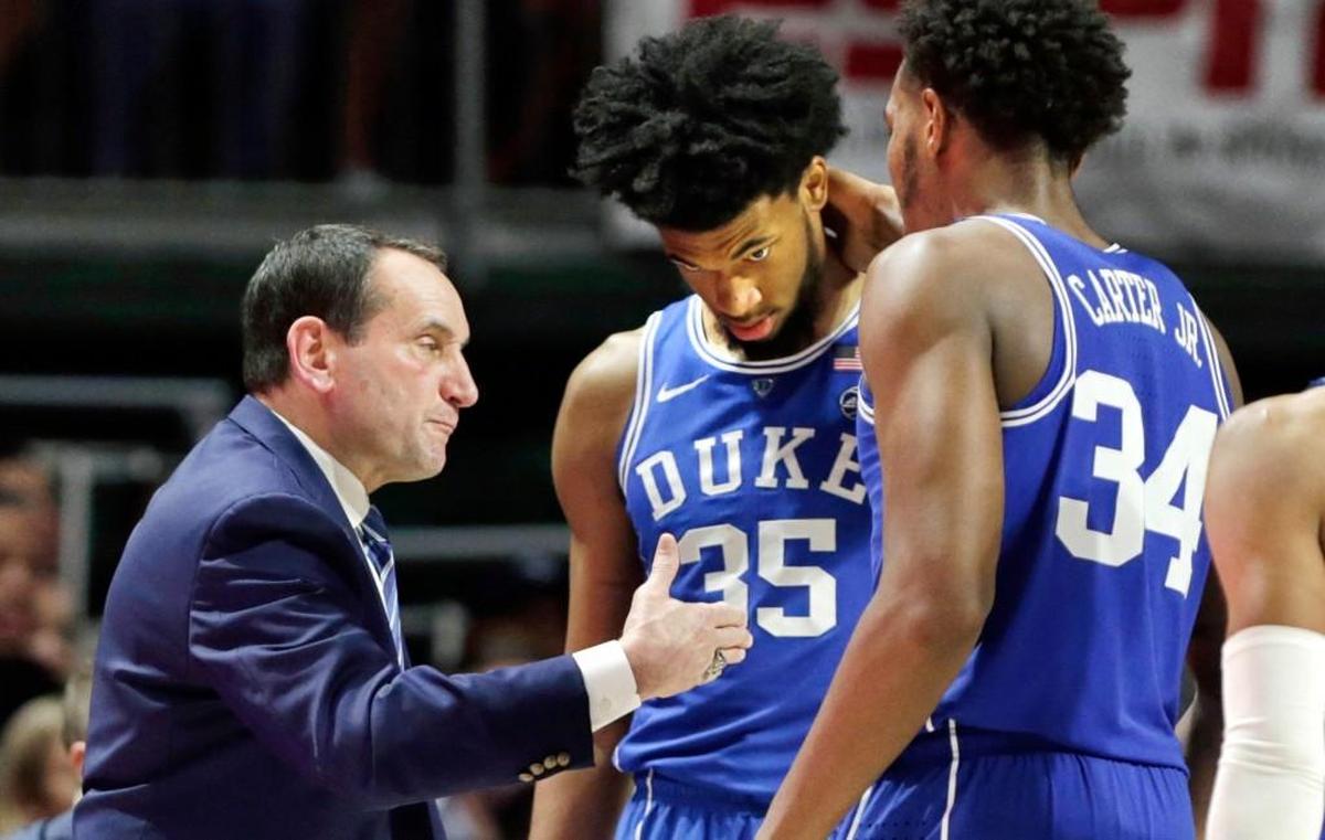 Duke head coach Mike Krzyzewski, left, talks with Marvin Bagley III (35) and Wendell Carter Jr (34) during the second half.