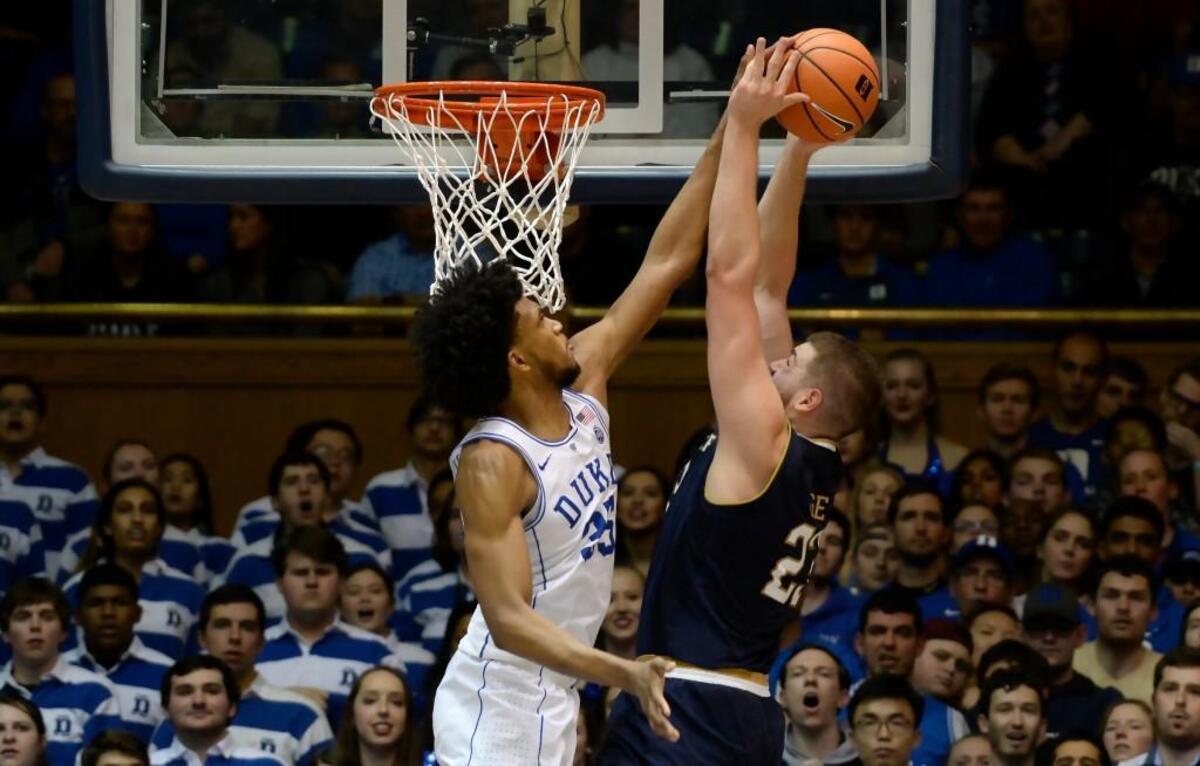 Duke forward Marvin Bagley III, left, blocks a shot by Notre Dame forward Martinas Geben on Monday.