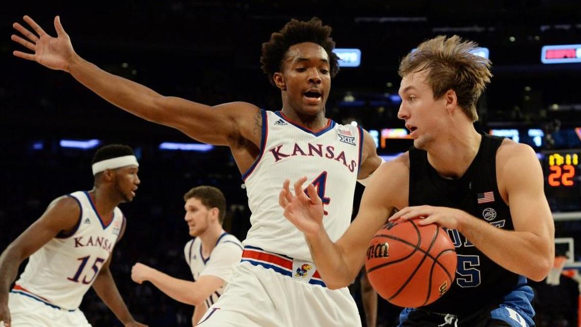Duke guard Luke Kennard, right, attempts to move the ball around Kansas guard Devonte' Graham on Nov. 15. Kennard, a sophomore starting guard, is averaging 36 minutes a game.