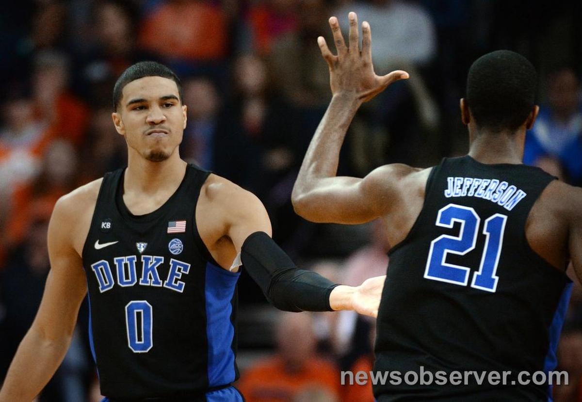Duke forward Jayson Tatum (0) gives teammate Amile Jefferson (21) a high five after hitting his sixth three pointer to put Virginia away. Duke beat Virginia 65-55 in Charlottesville, Va. Wednesday, Feb.15, 2017.