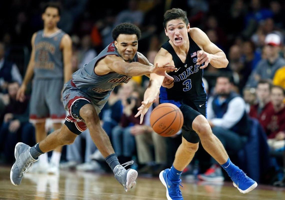 Boston College's Jerome Robinson (1) and Duke's Grayson Allen (3) chase a loose ball during the second half.
