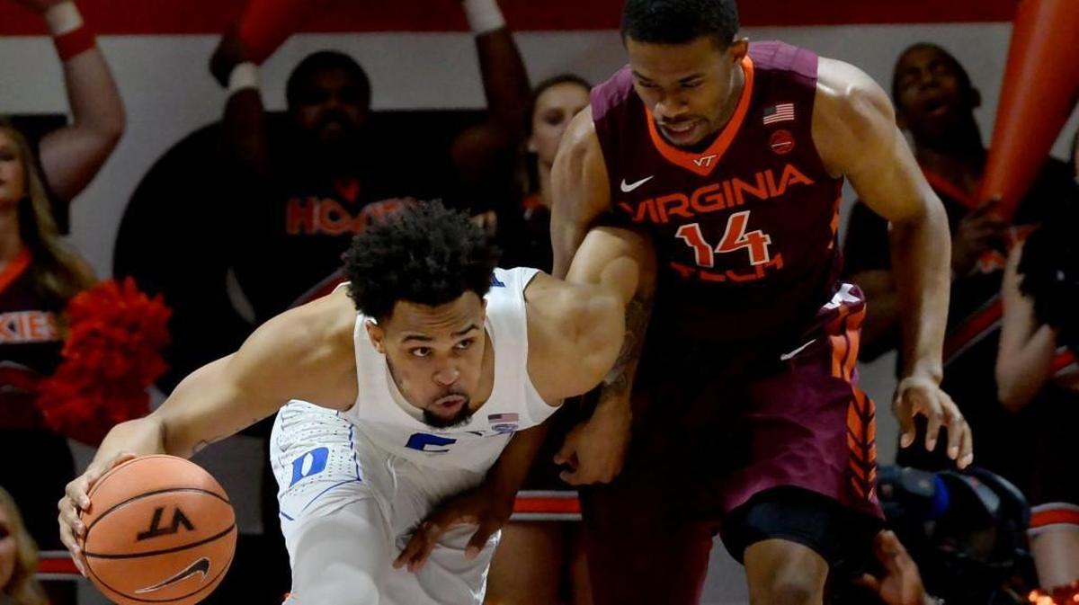 Duke guard Gary Trent Jr. (2) tries to drive around Virginia Tech forward P.J. Horne (14) in the first half of play. Duke was upset by Virginia Tech 64-63 at Cassell Coliseum, Monday, Feb. 26, 2018 in Blacksburg, Va.