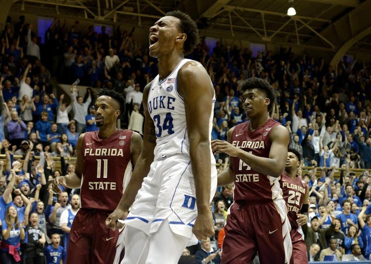 Duke forward Wendell Carter Jr (34) reacts after slamming the Blue Devils final points over Florida State guard Braian Angola (11) and guard Terance Mann (14). Duke defeated Florida State 100-93 at Cameron Indoor Stadium in Durham, N.C. Saturday, Dec. 30, 2017.