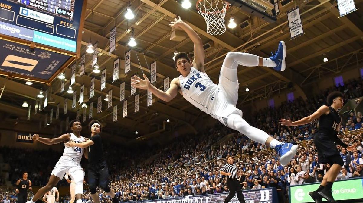 Duke guard Grayson Allen (3) goes in for a hard landing after Pittsburgh forward Kene Chukwuka (15) intentionally fouls him on a breakaway dunk attempt in the first half of play. . Duke battled Pitt, Saturday, Jan. 20, 2018 at Cameron Indoor Stadium in Durham, N.C.