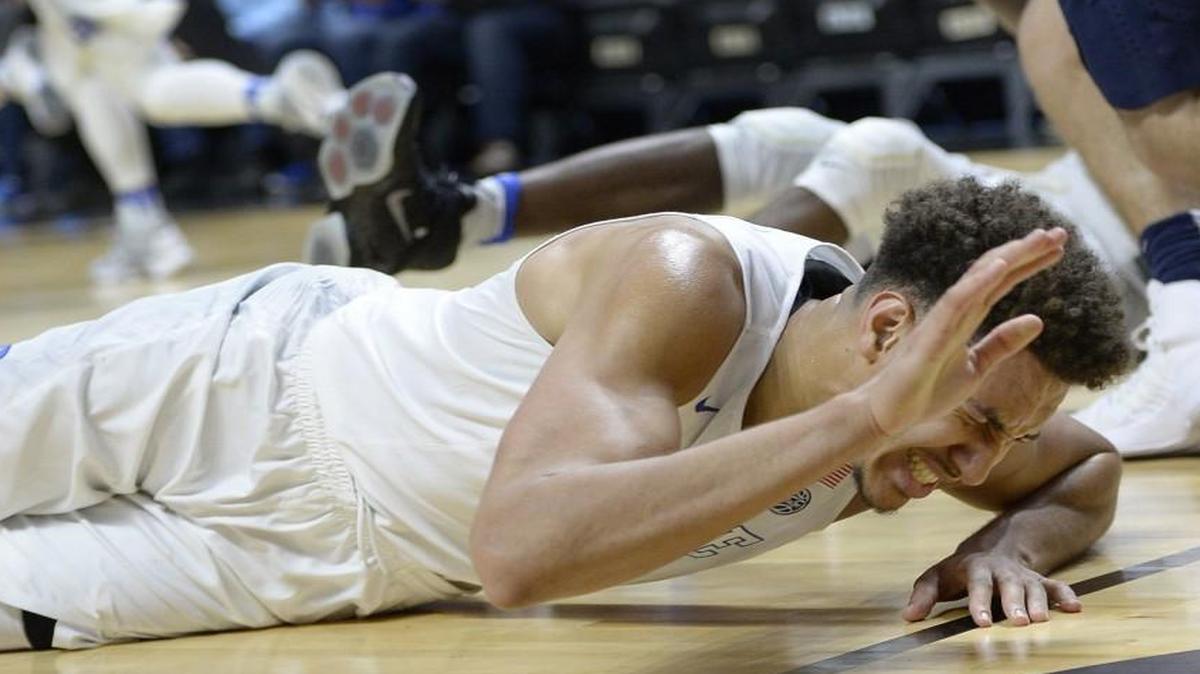 Duke's Chase Jeter reacts after injuring his ankle in the first half against Penn State.
