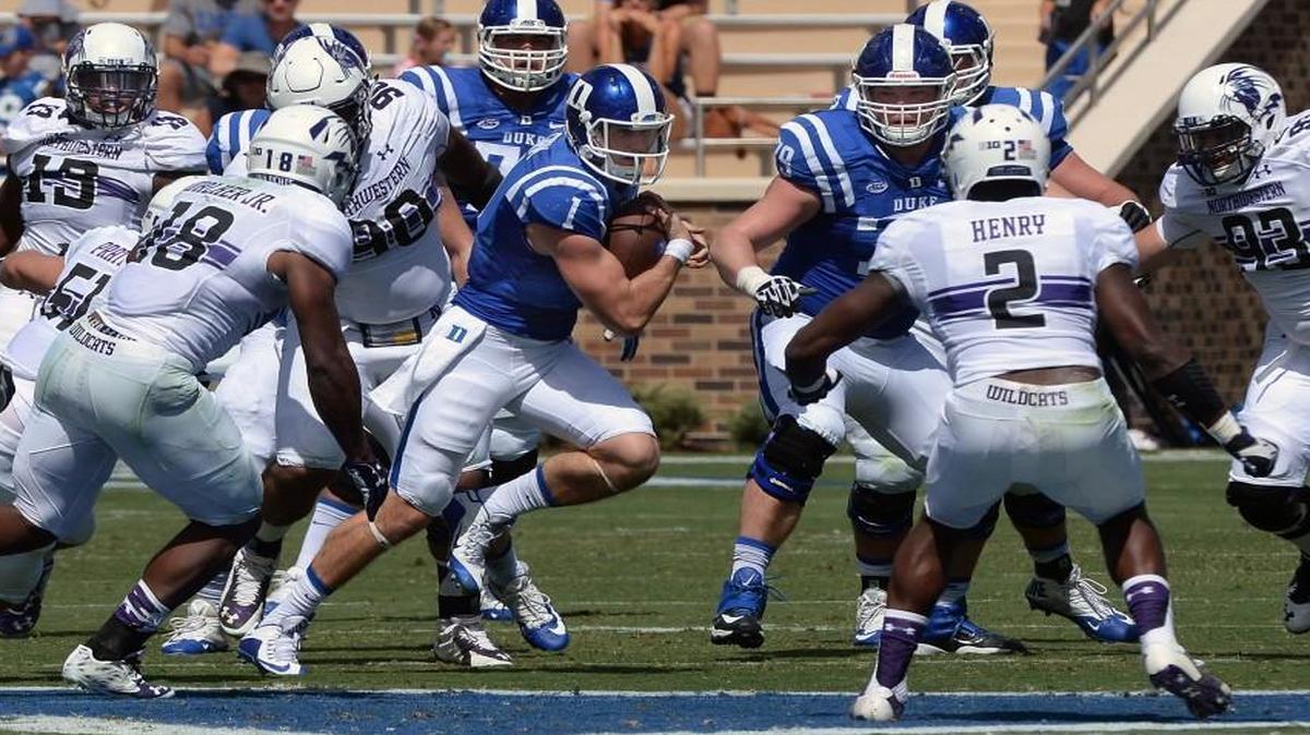 
Duke quarterback Thomas Sirk (1) attempts to get a first down against the Wildcat defense in the first half of play at Wallace Wade Stadium in Durham.
