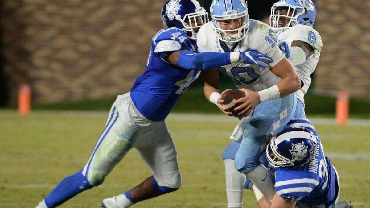 North Carolina quarterback Mitch Trubisky, middle, is sacked by Duke linebackers Joe Giles-Harris, left, and Ben Humphreys, bottom right, in 2016.