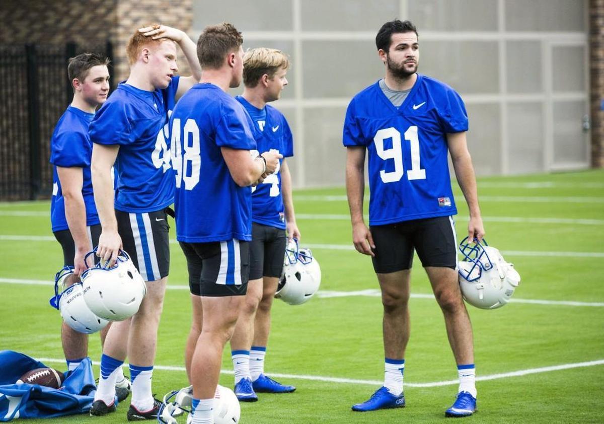 Willie Holmquist, right, walk-on kicker at Duke, practice on Aug. 2.