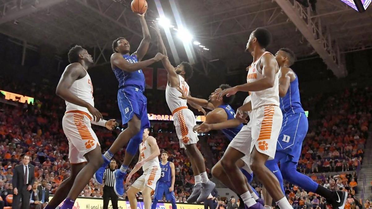 Duke forward Wendell Carter Jr (34) goes up to score in the second half of play as Clemson guard Gabe DeVoe (10) defends. Duke defeated Clemson 66-57.