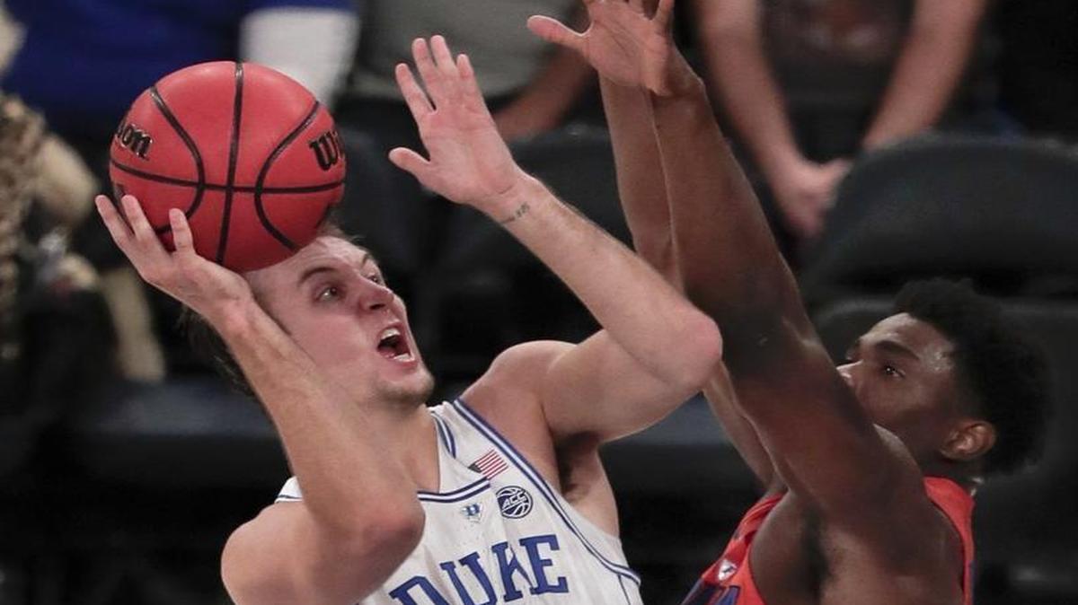 Duke’s Luke Kennard puts up a shot against Florida’s KeVaughn Allen in the first half.