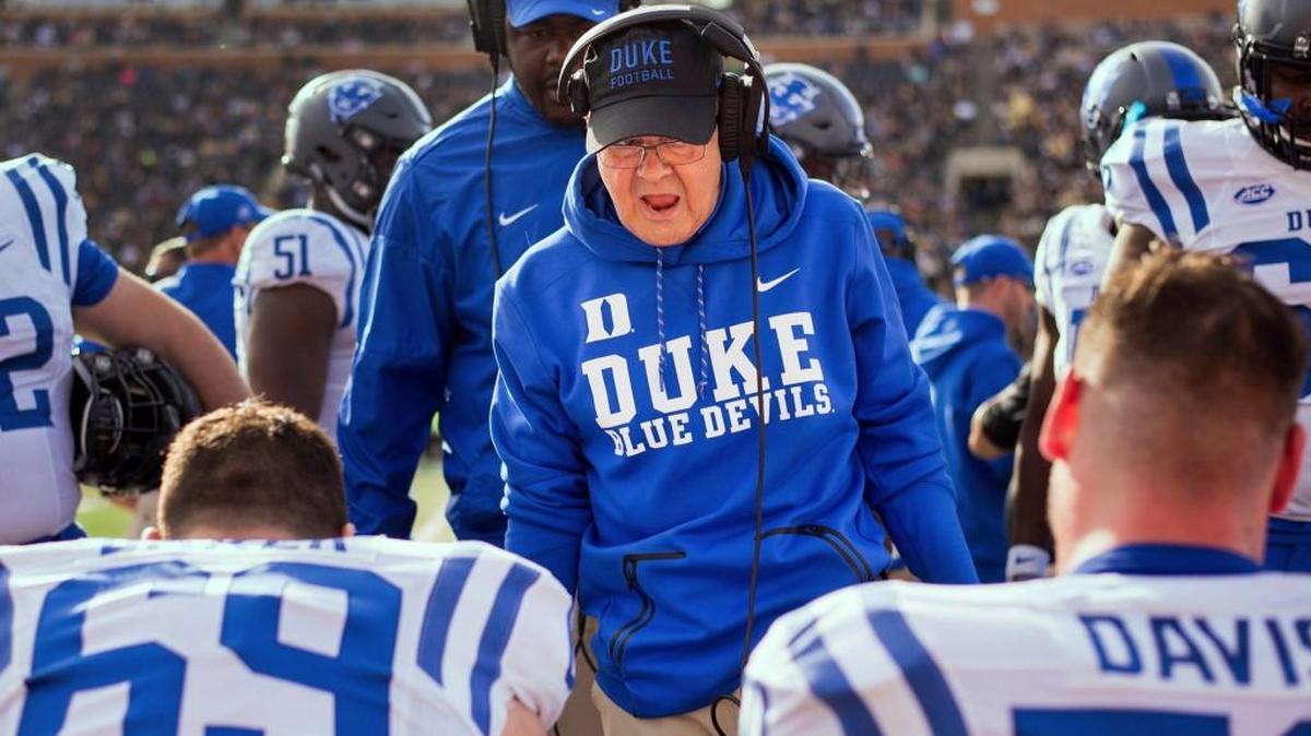 Duke head coach David Cutcliffe speaks to players on the sideline after a touchdown in the second quarter against Wake Forest.