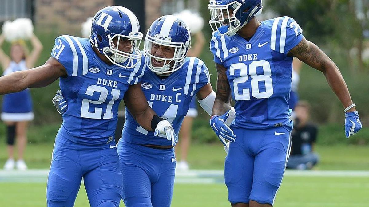 Duke defensive backs Alonzo Saxton II (21), Bryon Fields Jr., and Mark Gilbert react during the Blue Devils’ win over Northwestern.