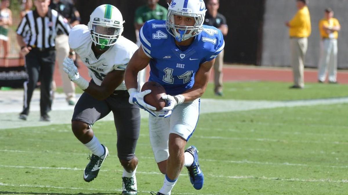 Duke cornerback Bryon Fields intercepts a pass intended for Tulane wide receiver Xavier Rush, left, in September 2014.