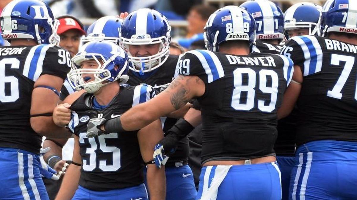 
Duke kicker Ross Martin (35) is congratulated by teammates after kicking what would end up being the winning field goal against the Boston College Eagles. 
