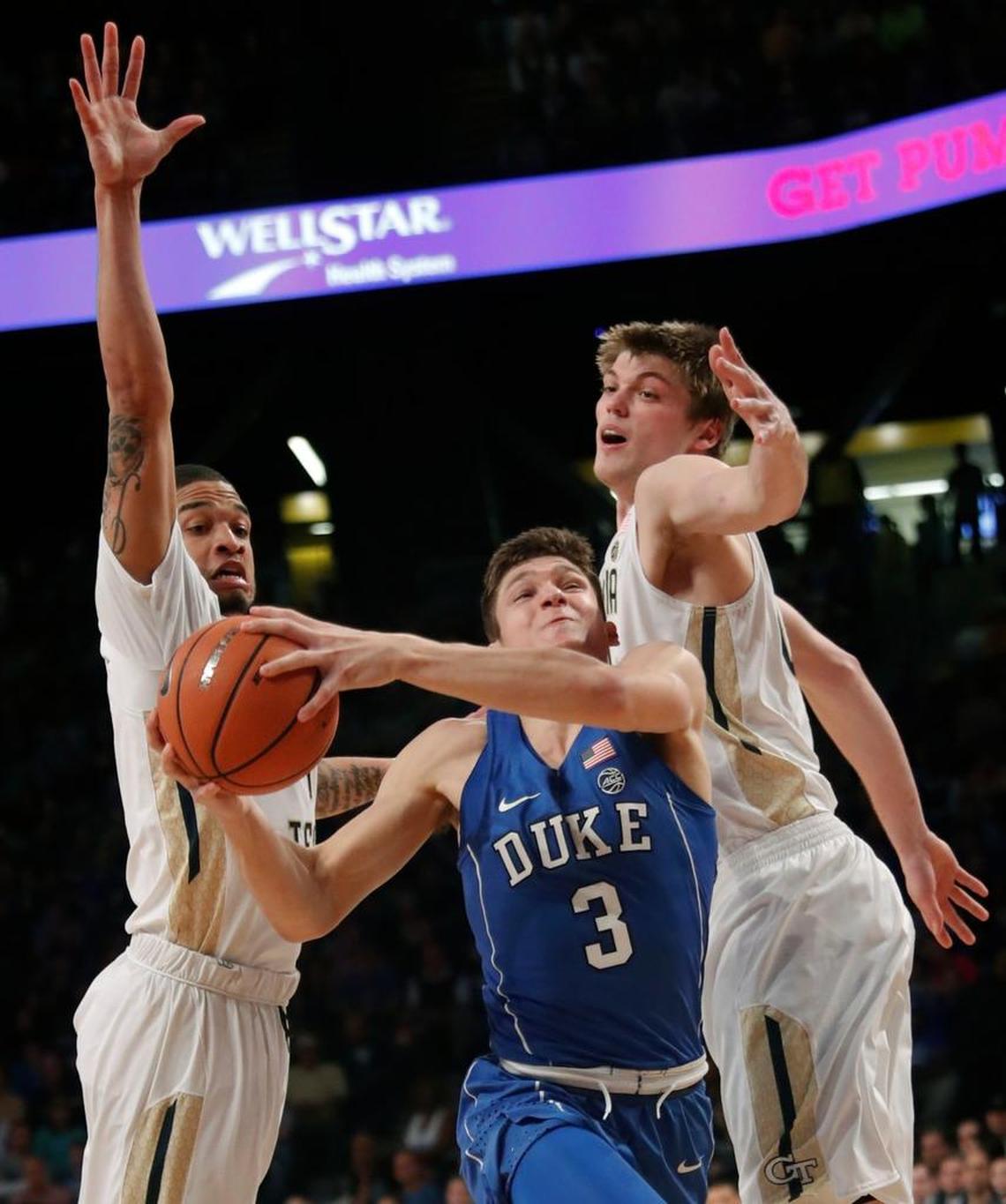 Duke guard Grayson Allen (3) drives between Georgia Tech's Tadric Jackson (1) and Ben Lammers (44).