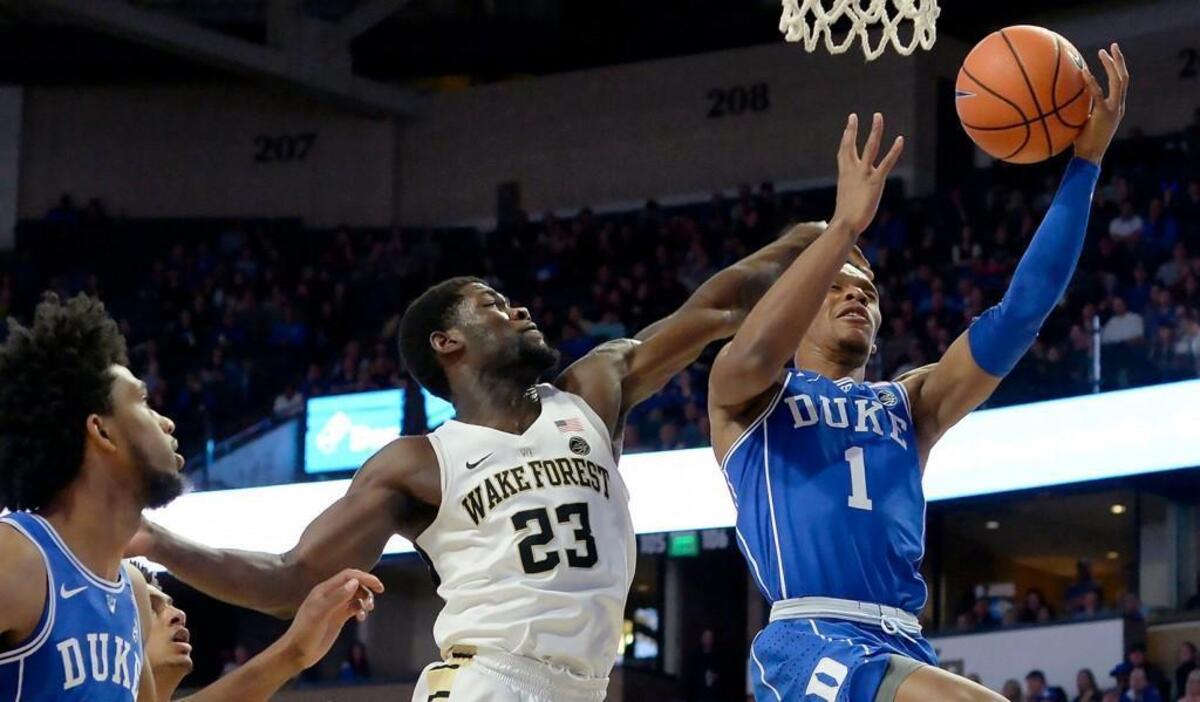 Duke guard Trevon Duval, right, is fouled by Wake Forest guard Chaundee Brown, middle, in the Blue Devils’ 84-70 win on Tuesday.
