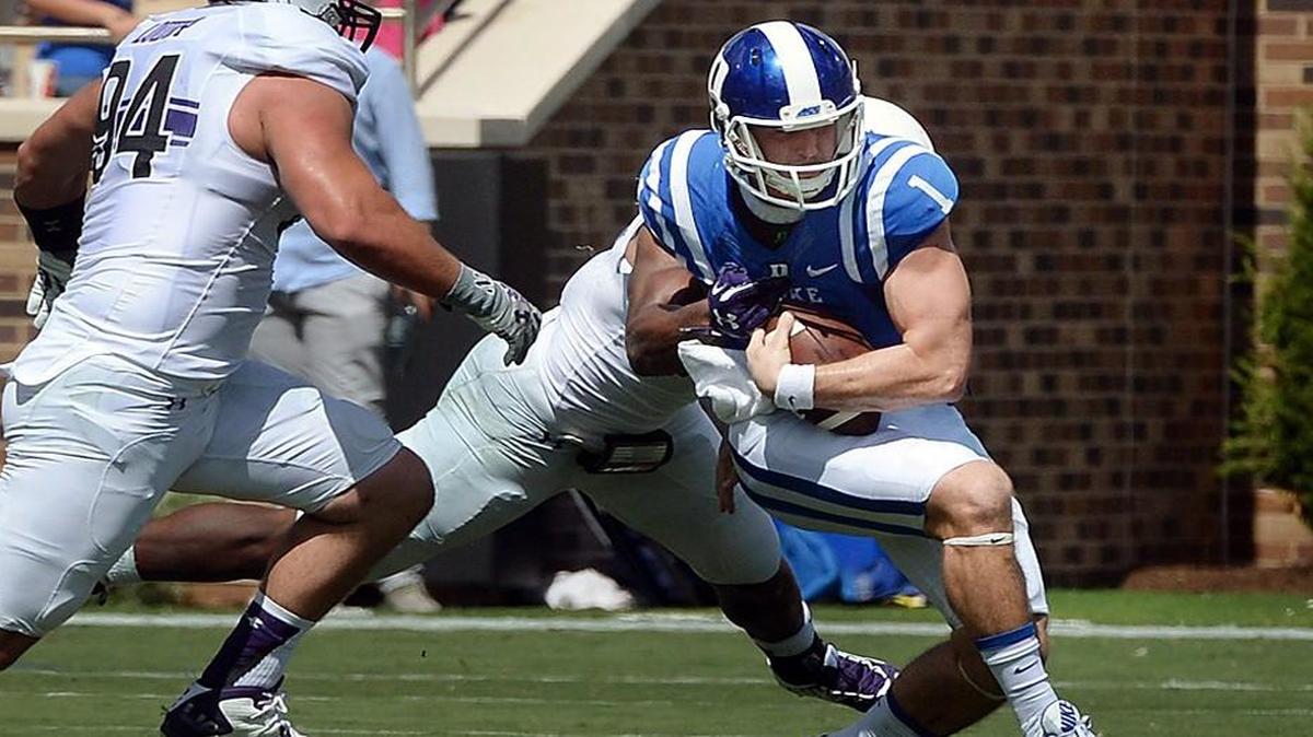 
Duke quarterback Thomas Sirk (1) is sacked in the fourth quarter as Northwestern defensive lineman Dean Lowry (94) comes in to help out at Wallace Wade Stadium at Duke University in Durham, N.C. Saturday, September 19, 2015.
