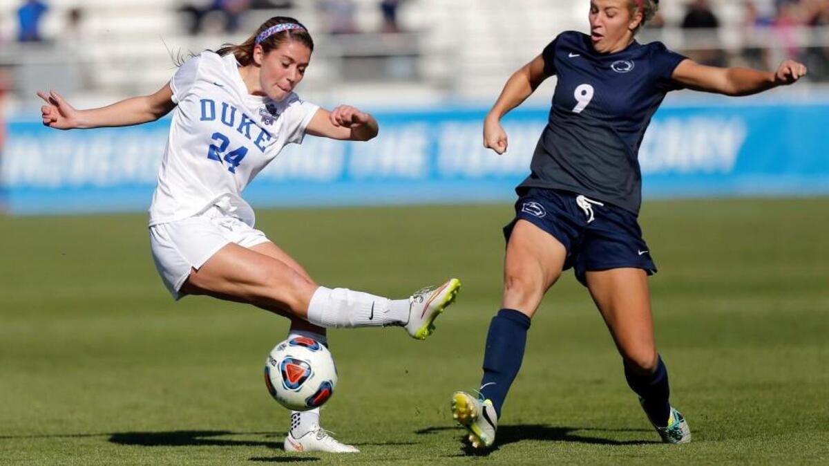 Duke’s Morgan Reid, left, battles Penn State’s Frannie Crouse for the ball during the NCAA Women’s College Cup Soccer Finals on Dec. 6, 2015.