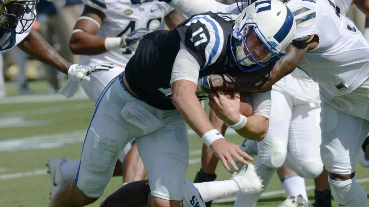 Duke quarterback Daniel Jones battles Pittsburgh's Rashad Weaver for yardage , Saturday, October 21, 2017, in Wallace Wade Stadium.