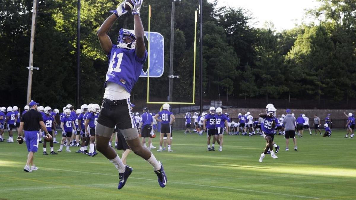 Duke wide receiver Scott Bracey catches a pass during the Blue Devils’ first football practice of the season on Monday.