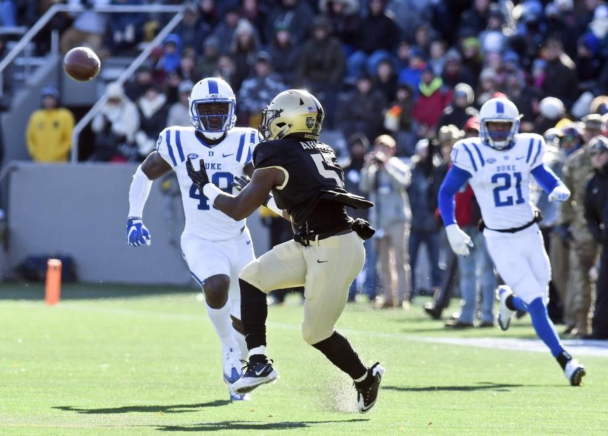 Army running back Kell Walker (5) makes a catch for 42 yards in front of Duke linebacker Koby Quansah (49) during the first half of an NCAA college football game on Saturday, Nov. 11, 2017, in West Point, N.Y. (AP Photo/Hans Pennink)